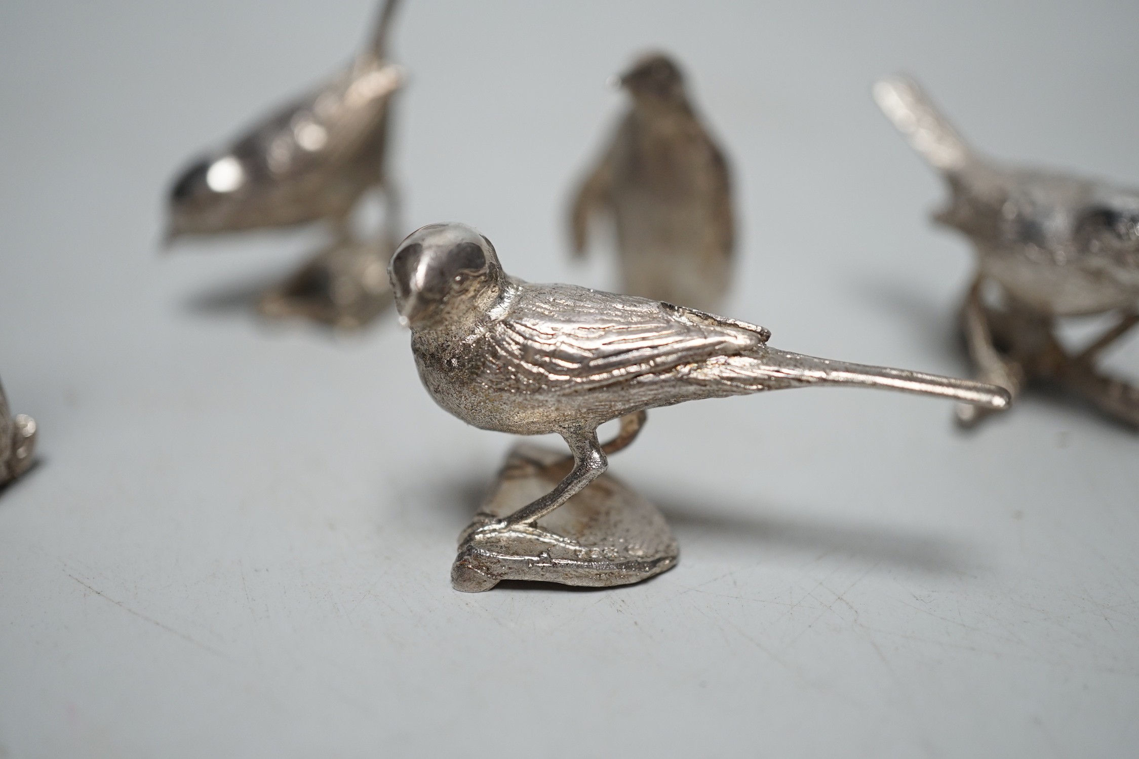 A small collection of seven 1980's/1990's miniature silver models, by Paul Eaton, comprising five birds, a rabbit and a penguin, tallest 43mm.